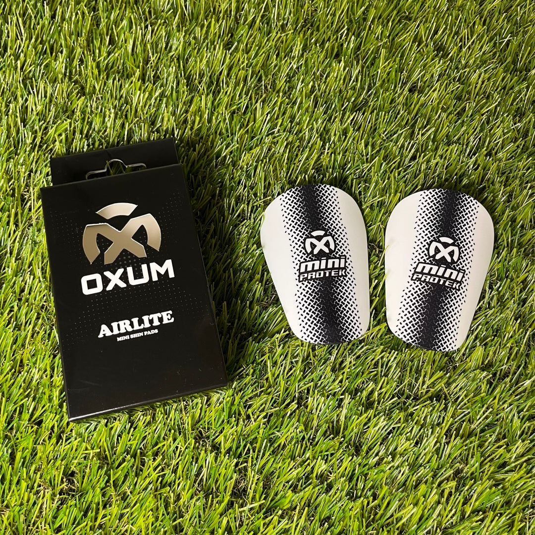AIRLITE BASIC ESPINILLERAS DE FÚTBOL